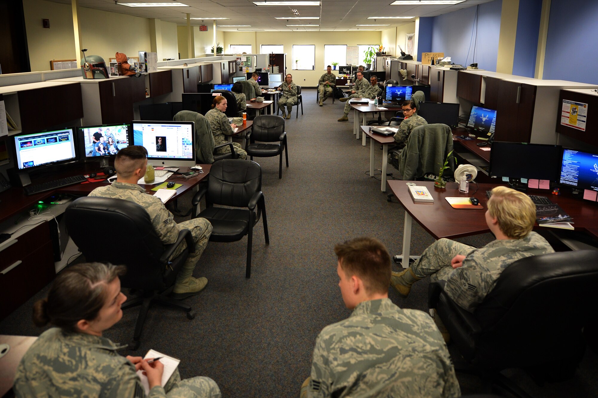 U.S. Airmen assigned to the 20th Fighter Wing (FW) Public Affairs (PA) office meet for a productivity meeting at Shaw Air Force Base, S.C., March 21, 2017. Photojournalists assigned to the 20th FW PA office are tasked with documenting base operations, as well as taking and distributing official studio and passport photos for Airmen who are applying for award packages and preparing for deployments and permanent changes of station. (U.S. Air Force photo by Airman 1st Class Christopher Maldonado)