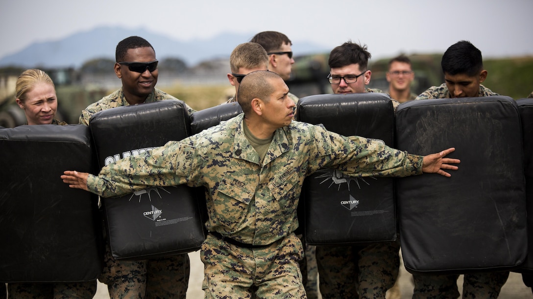 U.S. Marine Corps Gunnery Sgt. Ysac Perez, the air base ground defense staff non-commissioned officer in charge for Marine Wing Support Squadron 171, observes how Marines deal with the set objectives during exercise Tanuki Wrath at Marine Corps Air Station Iwakuni, Japan, March 22, 2017. MWSS-171 conducted the exercise to help train Marines to set up security around a downed aircraft and how to control a riot.