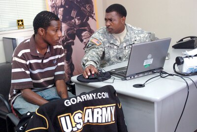 Army Staff Sgt. Roger L. Whaley speaks with Phillip McDonald about the possibility of becoming a journalist or X-ray technician for the Army at the U.S. Army Recruiting Station in Radcliff, Kentucky. Army photo by Sgt. Carl N. Hudson