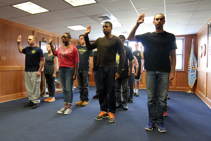 Applicants are sworn into service at the Military Entrance Processing Station on Joint Base McGuire-Dix-Lakehurst, N.J., Oct. 7, 2014. (Photo by Army Sgt. Richard W. Hoppe, released)
