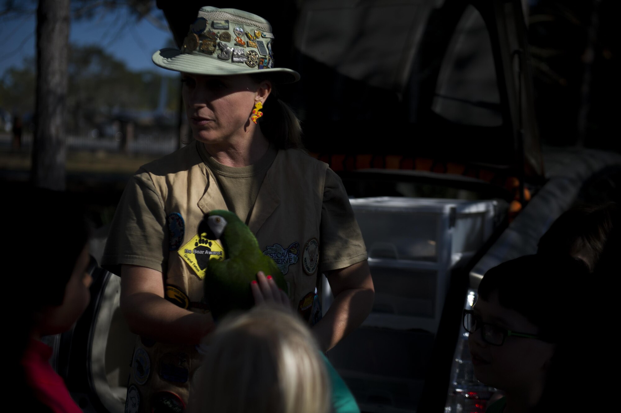 Nonie Maines, a sponsor with Nonie’s Ark Animal Encounters, lets a child pet a parrot at Hurlburt Field, Fla., March 17, 2017. Maines was one of many sponsors who attended the event which offered free sandwiches, chips and a fun environment for the whole family. (U.S. Air Force photo by Airman 1st Class Dennis Spain)