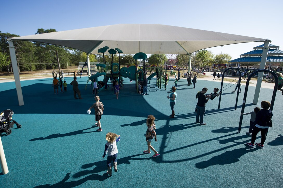 Air Commandos and their families attend a reopening celebration of the Lil' Commando Community Park at Hurlburt Field, Fla., March 17, 2017. The event was held to celebrate the reopening of the park after renovations were made. The event offered free food and entertainment as Hurlburts Lil' Air Commandos played on the new playground. (U.S. Air Force photo by Airman 1st Class Dennis Spain)