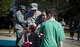 Maj. Jama Stilwell, an operations officer with the 1st Special Operations Force Support Squadron, cuts a ribbon with children during an event at Hurlburt Field, Fla., March 17, 2017. The 1st SOFSS held an event celebrating the reopening of the Lil' Commando Community Park after renovations were made including a new zip line, playground and splash pad for Air Commandos and families to enjoy. (U.S. Air Force photo by Airman 1st Class Dennis Spain)