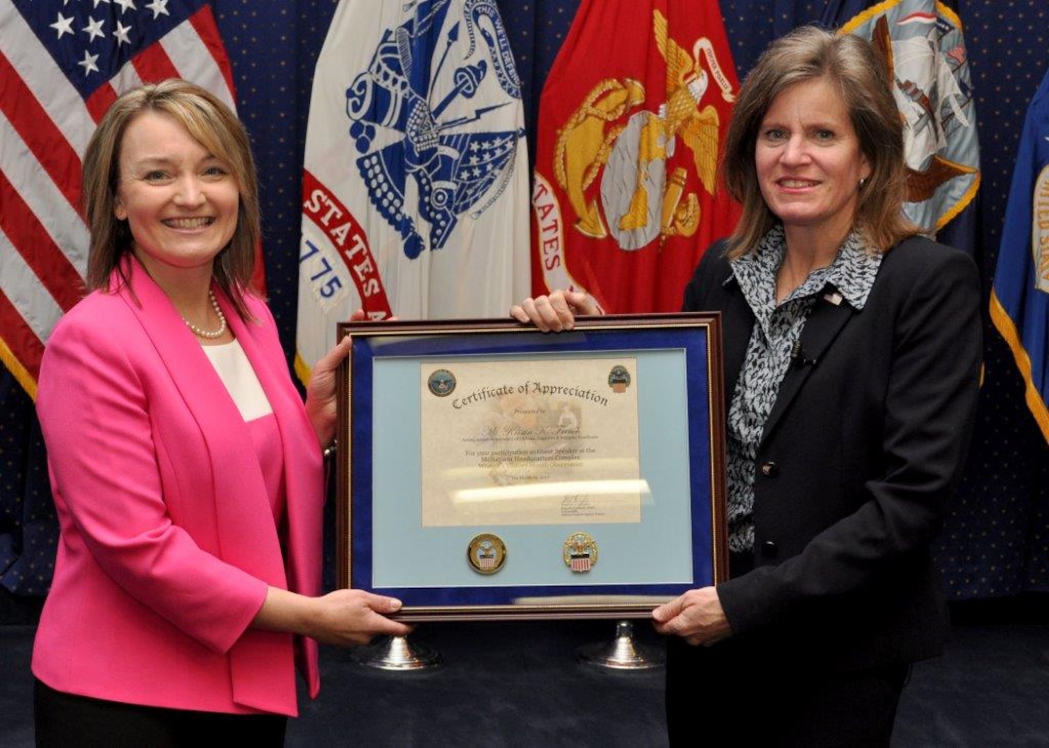 DLA Energy Acting Deputy Commander Gabby Earhart presents Acting Assistant Secretary of Defense for Logistics and Materiel Readiness Kristin French with a certificate of appreciation for her participation in the DLA Energy Women's History Month program, March 21. Photo by Ron Inman