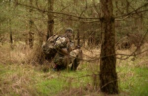 A U.S Air Force Air Commando from the 352nd Special Operations Wing gives a thumbs up during a field training exercise, March 8, 2016, at the Stanford Training Area, England. Airmen were instructed on how to properly survive, evade, resist and escape if taken by captors. (U.S. Air Force photo by Senior Airman Christine Halan)