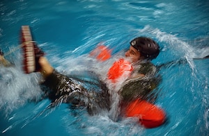 A U.S. Air Force Airman gets pulled through the water during Water Survival Training March 10, 2017, at Lowestoft College, Maritime and Offshore Facilities, England. This exercise focused on what it would be like being pulled through the water if attached to a parachute and how to escape. (U.S. Air Force photo by Senior Airman Christine Halan)