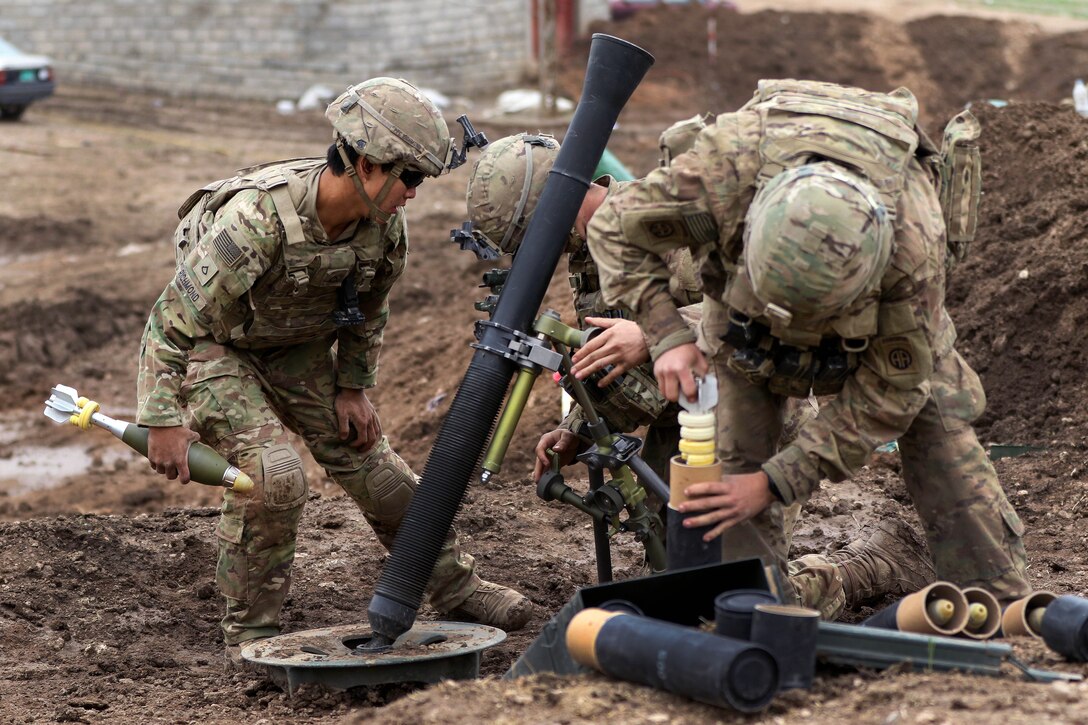 Soldiers prepare an M224 mortar system for a fire mission supporting the Iraqi army's 9th Division near Tarab, Iraq, March 18, 2017. Army photo by Staff Sgt. Jason Hull