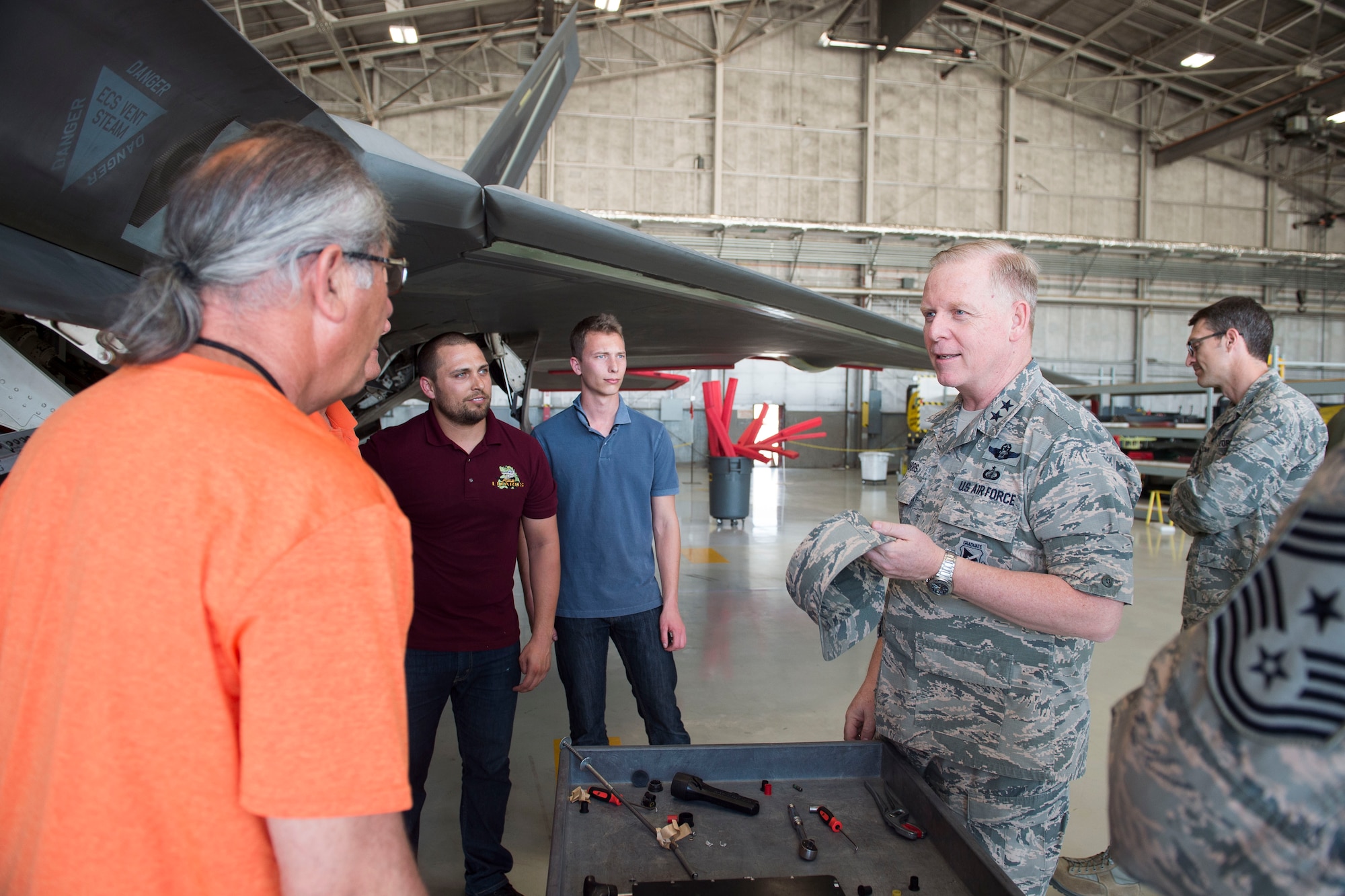 Members of the 411th Flight Test Squadron (left) speak with Maj. Gen. David Harris, Air Force Test Center commander, at the squadron's new facility March 16. Harris was conducting one of his monthly visits to various units at Edwards, which offers some time to meet with the 412th Test Wing workforce. (U.S. Air Force photo by Ethan Wagner)
