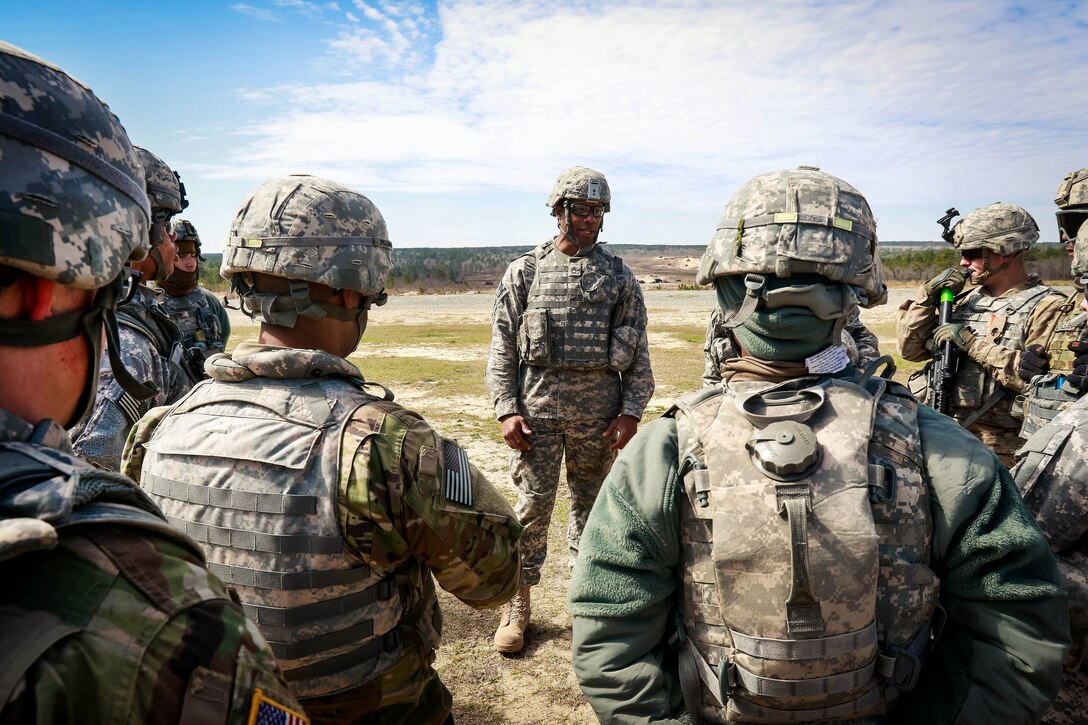 Army Sgt. 1st Class Davis, center, briefs soldiers on safety procedures before a M136 AT4 rocket launcher training exercise at Fort Bragg, N.C., March 17, 2017. Davis is assigned to the 82nd Airborne Division’s 122nd Aviation Support Battalion, 82nd Combat Aviation Brigade. Army photo by Capt. Adan Cazarez