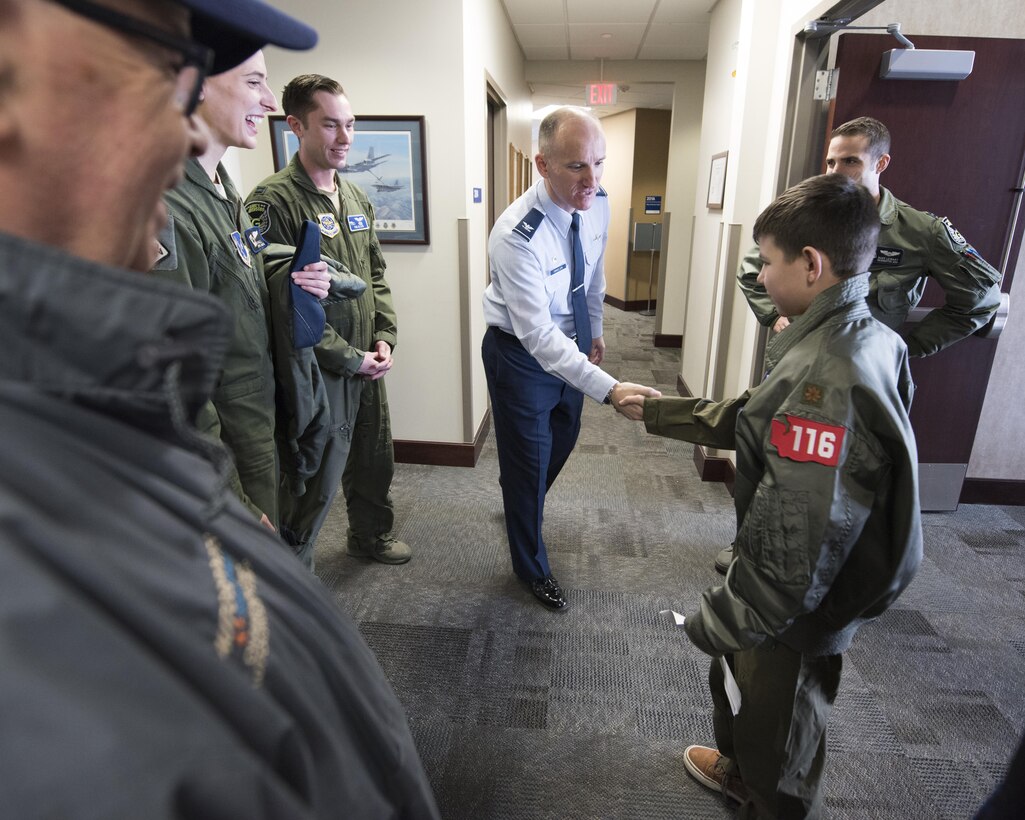 Col. Ryan Samuelson, 92nd Air Refueling Wing commander, welcomes "Pilot for a Day" candidate Gabe Tesch to the start of his training March 1, 2017, at Fairchild Air Force Base, Wash. Gabe spent the day visiting several workcenters throughout the base receiving hands on instruction and briefings on what it takes to be a KC-135 pilot. The "Pilot for a Day" program provides disadvantaged or seriously ill children a chance to spend the day with members of the Washington Air National Guard training as an honorary pilot. (U.S. Air Force photo by Master Sgt. Michael Stewart/Released)