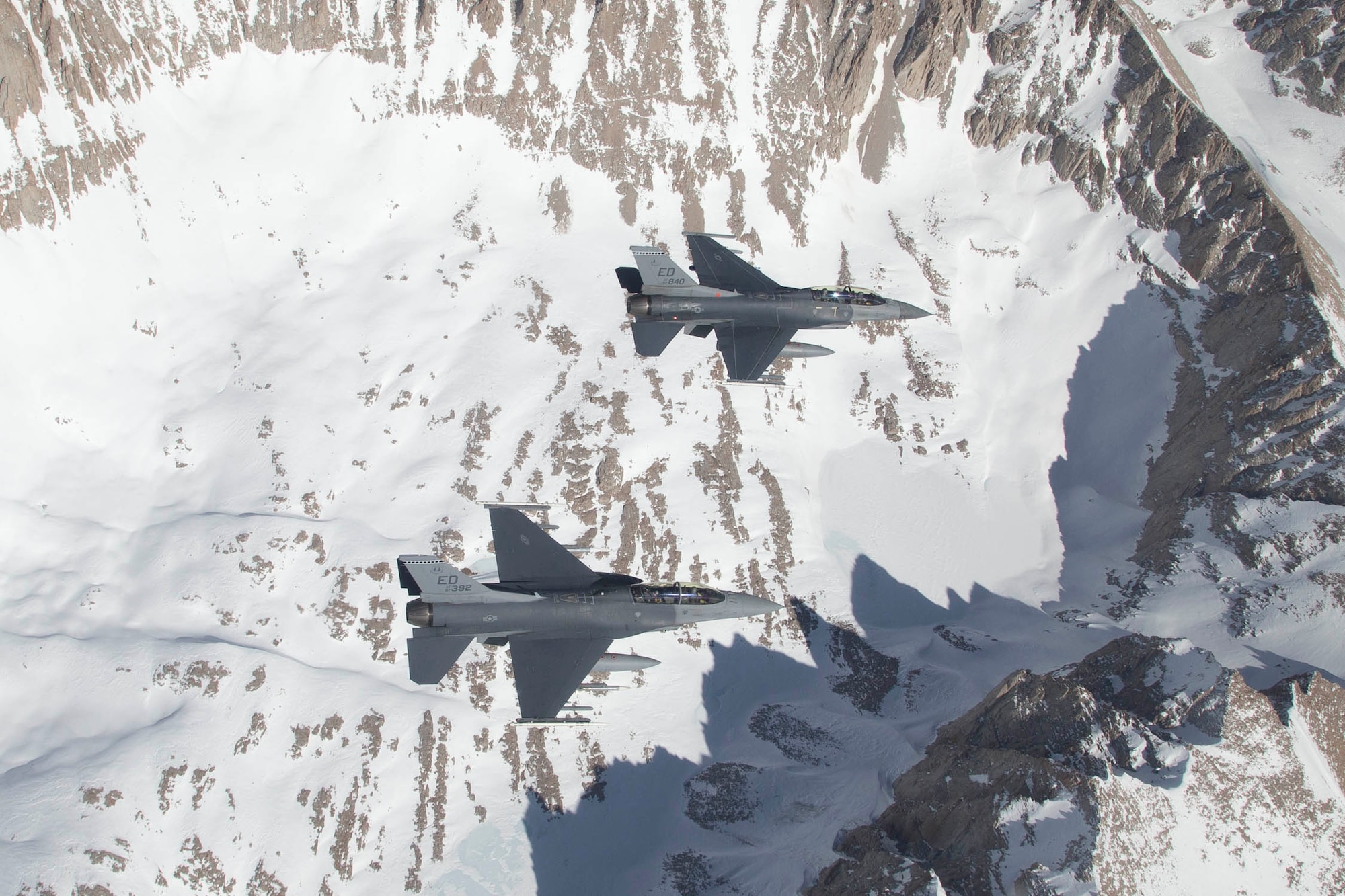 Photo of F-16 Fighting Falcons from the 416th Flight Test Squadron conducting in-flight testing of the APG-83A radar installed onboard one of the jets March 20. (U.S. Air Force photo by Christopher Okula)