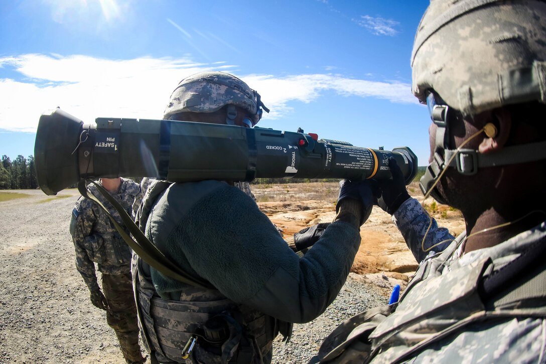 A soldier positions a M136 AT4 rocket launcher over his shoulder before firing during a training exercise at Fort Bragg, N.C., March 17, 2017. Army photo by Capt. Adan Cazarez