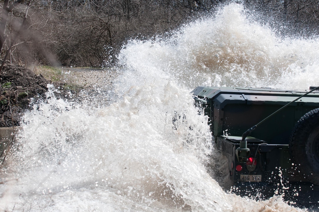 A 416th TEC Soldier fords a water obstacle during a portion of the offroad driving course at the Joliet Training Area, Elwood, Ill. The water fording offers trainees the ability to feel how the M1165 A1 HWMMV navigates all types of water obstacles, in a controlled environment (U.S. Army photo by Staff Sgt. Jason Proseus/released).