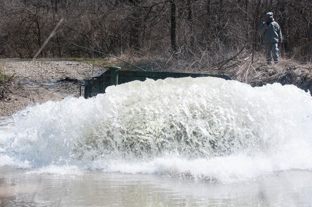 A 416th TEC Soldier fords a water obstacle during a portion of the offroad driving course at the Joliet Training Area, Elwood, Ill. The water fording offers trainees the ability to feel how the M1165 A1 HWMMV navigates all types of water obstacles, in a controlled environment (U.S. Army photo by Staff Sgt. Jason Proseus/released).