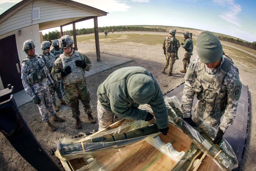 Soldiers unpack M136 AT4 rocket launcher before participating in a training exercise at Fort Bragg, N.C., March 17, 2017. Army photo by Sgt. Steven Galimore
