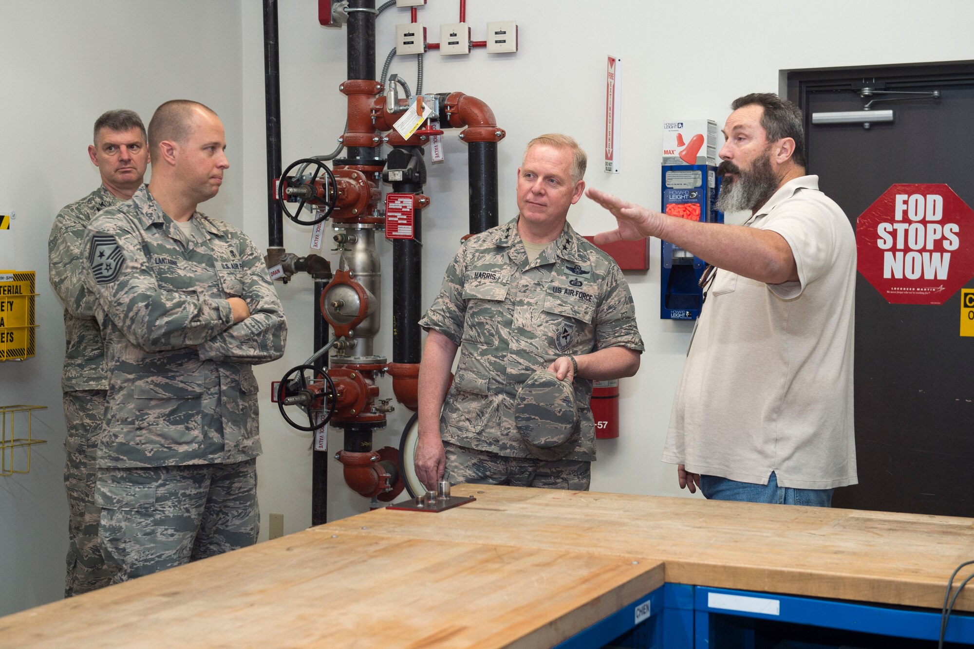 Maj. Gen. David Harris, Air Force Test Center commander, meeting with 411th Flight Test Squadron personnel, while touring the recently moved F-22 compound. (U.S. Air Force photo by Ethan Wagner)