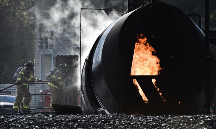 Members of the Boeing Fire Emergency Services fight a controlled fire as part of a live-fire exercise at Joint Base Charleston, South Carolina, March 21, 2017. Members of the 628th Civil Engineer Squadron worked with Boeing to fulfill live-fire training requirements. 