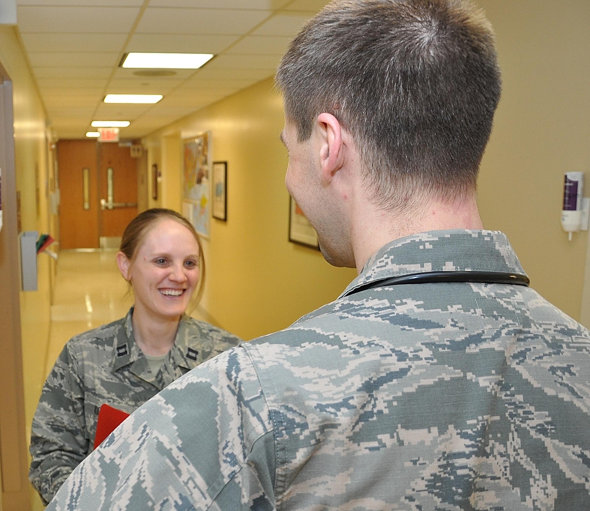Pediatrician Major (Dr.) Michelle Kiger, 88th Medical Operations Squadron, discusses some of the day’s issues with Capt.(Dr.) Eric Engstrom, 88th MDOS Pediatric Resident physician, during her rounds at the Wright-Patterson Air Force Base, Ohio, Medical Center. Kiger and Engstrom, as well as all physicians across America, are being lauded during National Doctors Day observances, March 30. (U.S. Air Force photo by Will Huntington) 