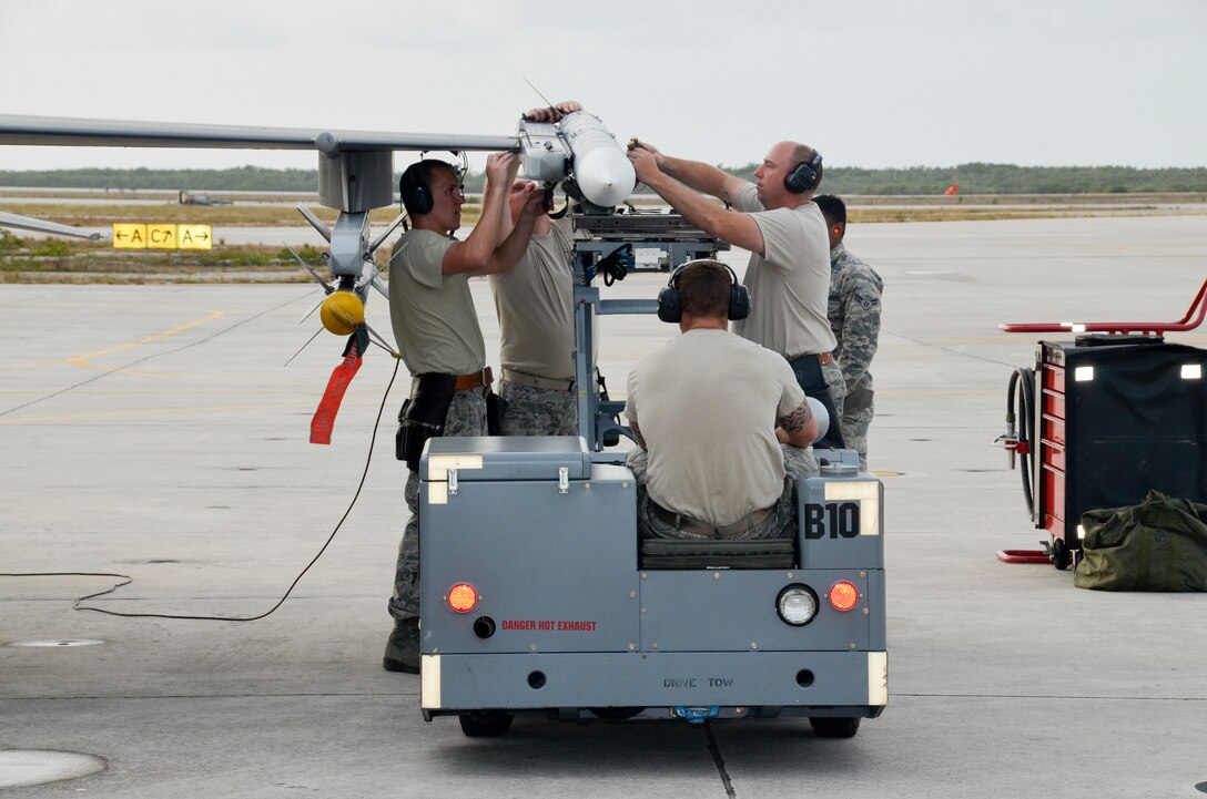 114th Aircraft Maintenance weapon loaders mount a training missile on a F-16C during a training mission March 14, 2017, Naval Air Station Key West, FL. The purpose of the deployment was to train with the U.S. Navy and Canadian Air Force. This training serves as the culmination of the 175th Fighter Squadron air-to-air training. (U.S. Air National Guard photo by Maj. Travis Schuring/Released)