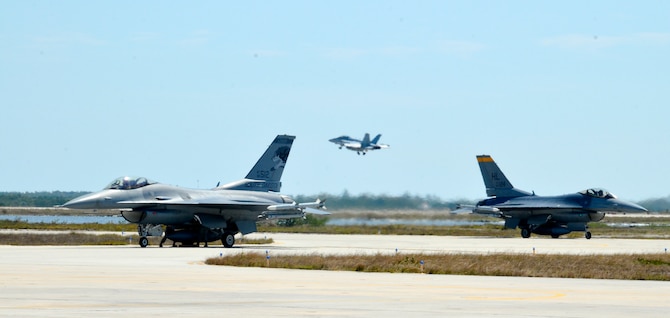 114th Aircraft Maintenance weapon loaders mount a training missile on a F-16C during a training mission March 14, 2017, Naval Air Station Key West, FL. The purpose of the deployment was to train with the U.S. Navy and Canadian Air Force. This training serves as the culmination of the 175th Fighter Squadron air-to-air training. (U.S. Air National Guard photo by Maj. Travis Schuring/Released)