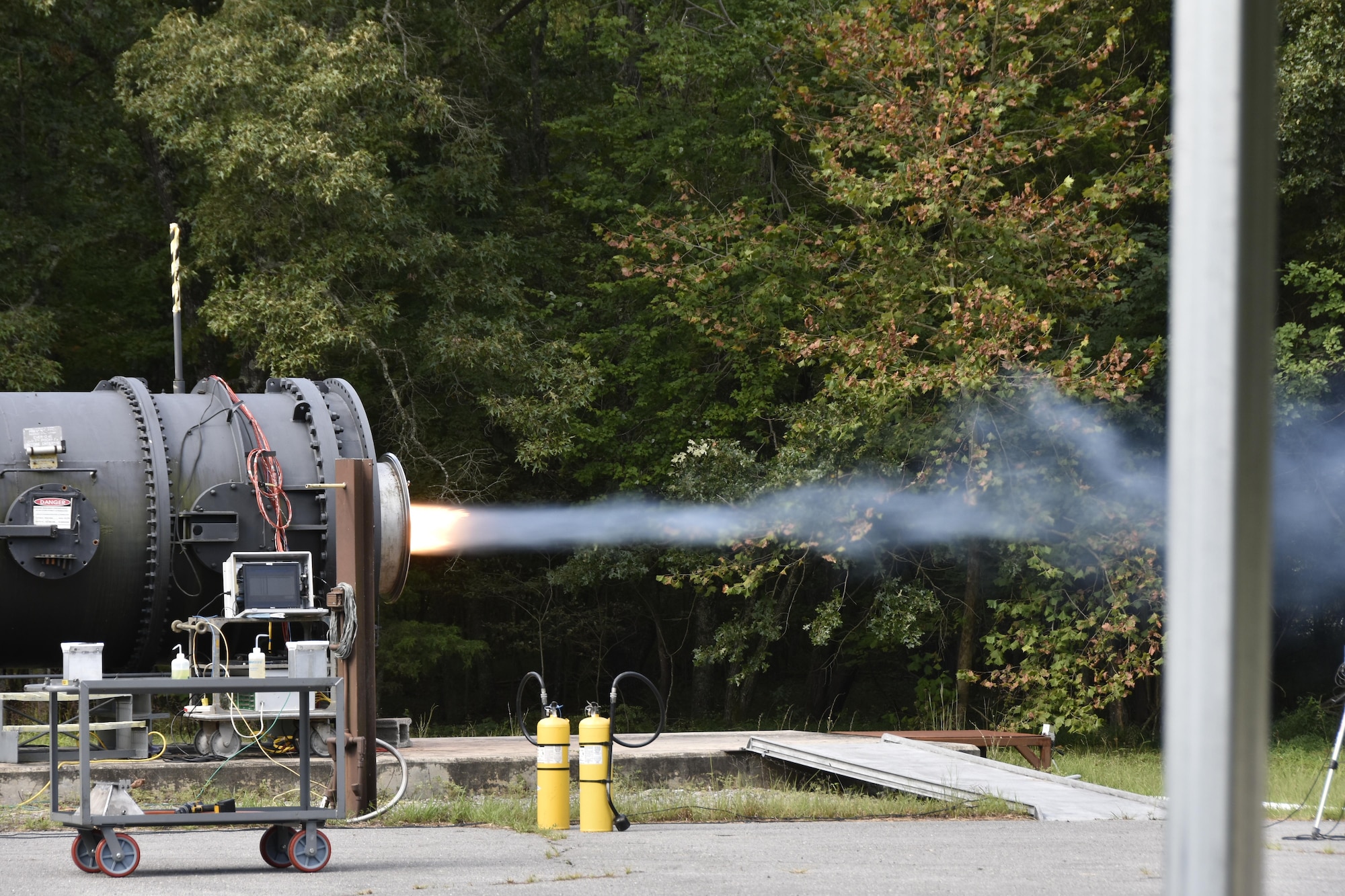 AEDC engineers test the Towed Airborne Plume Simulator (TAPS), a missile simulator that can be towed 500 to 1000 meters behind an aircraft to test early warning sensors on military aircraft and allow for either evasive or defensive action. The TAPS system is tested at the AEDC High Speed Fan Facility prior to a flight mission. There TAPS plume is controlled to mimic the behavior of a surface-to-air missile plume. In February, the AEDC TAPS team was named the recipient of the Outstanding Scientist Team Award, one of the AEDC Science, Engineering and Technical Management Awards presented for outstanding performance in management. (U.S. Air Force photos/Jacqueline Cowan)  