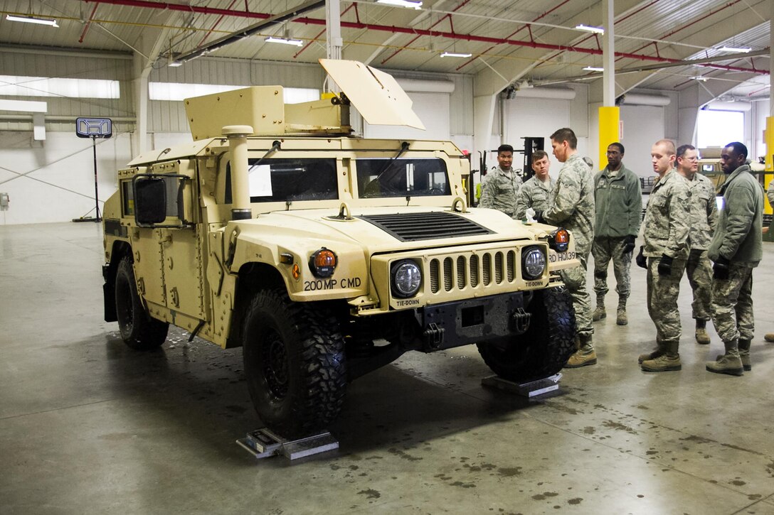 A U.S. Airmen prepare for a joint inspection an up-armored Humvee at Joint Base McGuire-Dix-Lakehurst, N.J., on March 18, 2017. The Airmen, who are assigned to the 621st Contingency Response Wing, spent the day with U.S. Army Reserve Soldiers from the 200th Military Police Command to inspect their up-armored Humvees in preparation for an air-land mission into Lakehurst Maxfield Field to kick off the ground operations of Warrior Exercise 78-17-01, which will be held March 8 to April 1, 2017. Roughly 60 units from the Army Reserve, Army, Air Force, Marine Reserves, and Canadian Armed Forces participated in the training exercise, which is a large-scale collective training event designed to assess units’ combat capabilities as America’s Army Reserve continues to build the most capable, combat-ready and lethal Federal Reserve force in the history of the Nation. (Army Reserve Photo by Master Sgt. Mark Bell / Released)