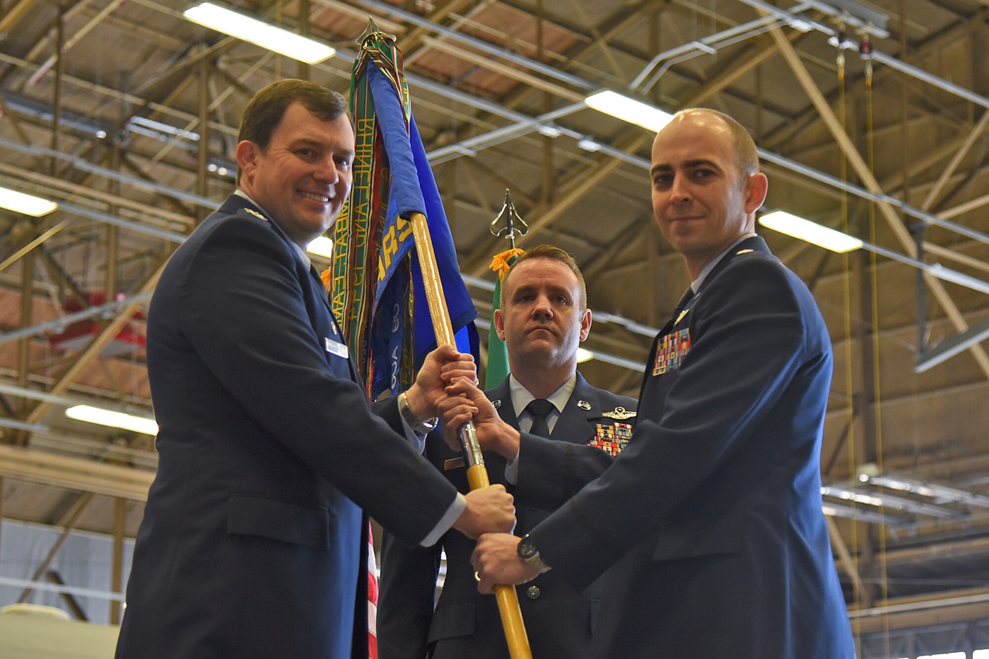 Lt. Col. Sean McClune assumes command of the 384th Air Refueling Squadron during an assumption of command ceremony Mar. 23, 2017, at Fairchild Air Force Base, Washington. Col. Todd Cargle, 92nd Operations Group commander, officiated the ceremony and presented McClune with his first commander’s badge. (U.S. Air Force photo/Senior Airman Mackenzie Richardson)