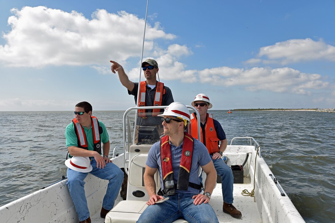Engineers from the U.S. Army Corps of Engineers, Mobile District (USACE), inspect the Bayou Caddy Ecosystem Restoration Project from a boat in the Mississippi Sound, Mar. 21. The project is expected to wrap up by the end of this month and will enhance the resiliency of the Mississippi coast. 