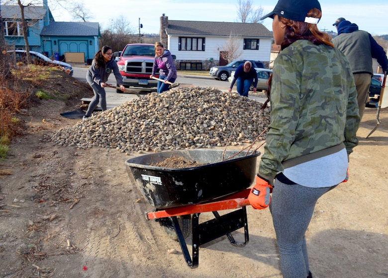 A team of women from Ellsworth Air Force Base landscape a Habitat for Humanity home during a build in Rapid City, S.D., March 18, 2017, as part of Women’s History Month. Nine women participated in the event to not only spread awareness for the month but to give back to the community. (U.S. Air Force photo by Airman 1st Class Donald C. Knechtel)