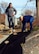 An Airman with the 89th Attack Squadron and Airman 1st Class Malyiah Arbuckle, a food service apprentice assigned to the 28th Force Support Squadron, work on rock landscaping during a Habitat for Humanity home build in Rapid City, S.D., March 18, 2017, as part of Women’s History Month. The team used plastic tarp as a barrier underneath the rock landscape to prevent weeds from growing. (U.S. Air Force photo by Airman 1st Class Donald C. Knechtel)