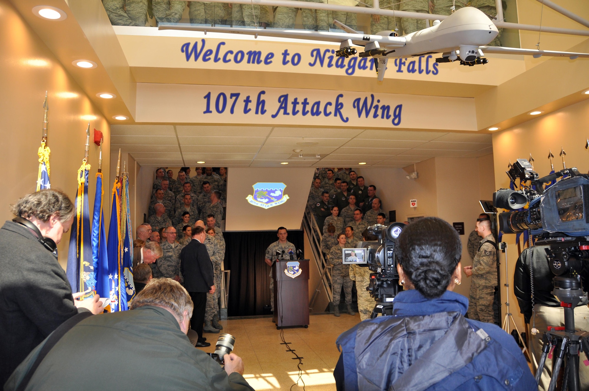 Members of the 107th Attack Wing along with invited guests and local media outlets gather for the official ceremony announcing the redesignation of the 107th from an airlift wing to an attack wing, March 21, 2017 at the Niagara Falls Air Reserve Station N.Y.  The 107 ATKW, NY Air National Guard, is the largest tenant organization on NFARS. The host unit of the base, the 914th Airlift Wing of the Air Force Reserve will be receiving its own redesignation in June as it converts from an airlift wing to an air refueling wing.  (U.S. Air Force photo by Master Sgt. Kevin Nichols)