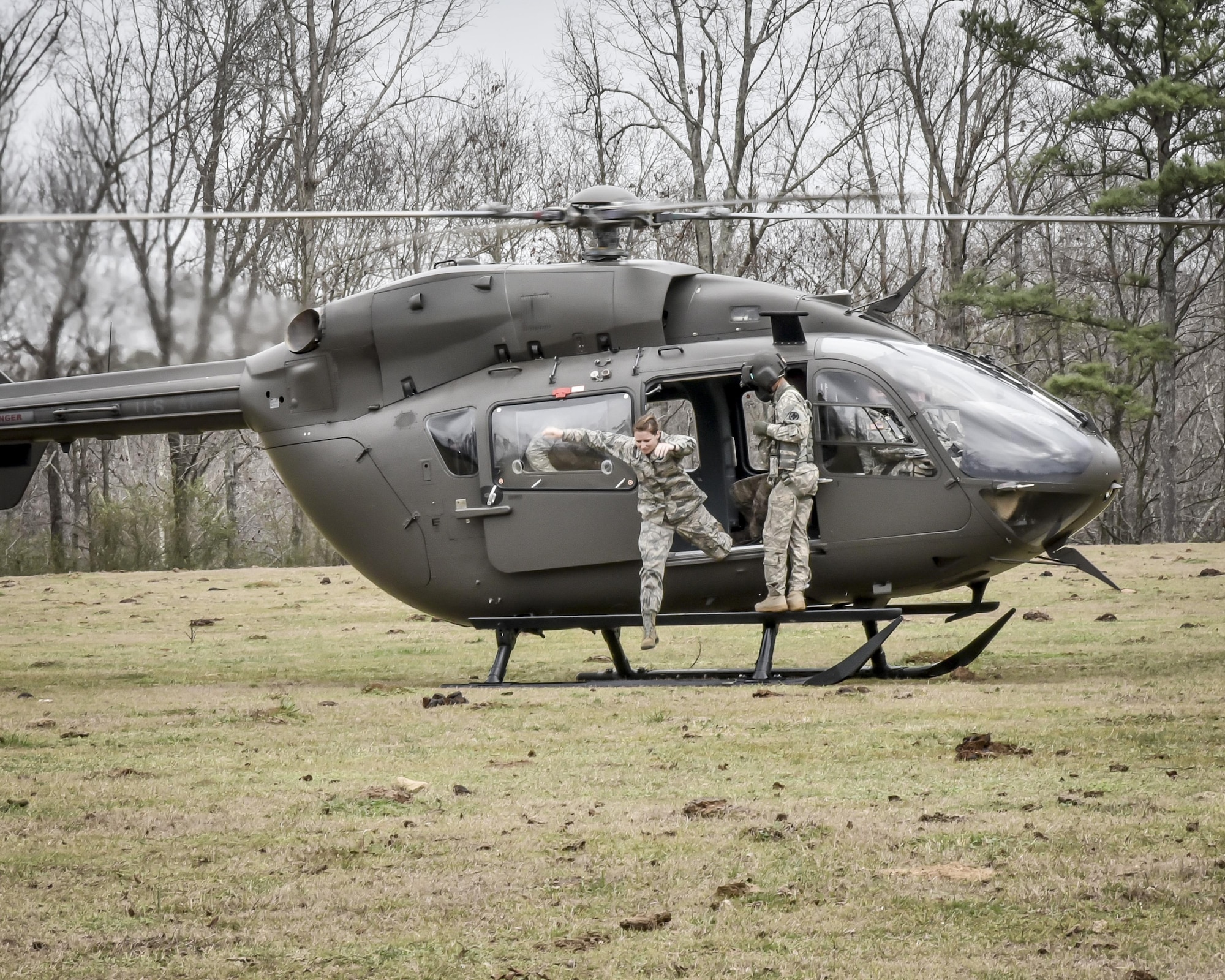 Aircrew from the 117th Air Refuelling Wing exit an Alabama Army National Guard helicopter during survival training in Hanceville, Alabama February 12, 2017. (U.S. Air National Guard photo by: Senior Master Sgt. Ken Johnson)