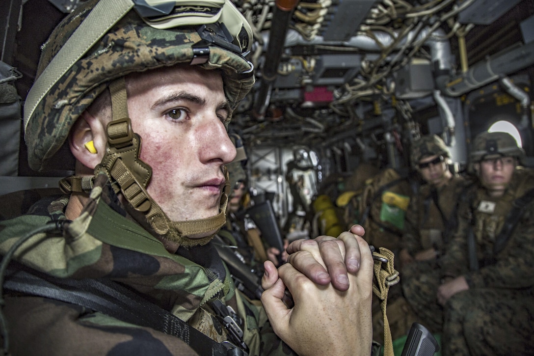 Marine Corps Staff Sgt. Dylan Worrell views the landscape from outside an MV-22 Osprey in Okinawa, Japan, March 21, 2017.  Worrell is an incident commander assigned to the 3rd Marine Division's Chemical, Biological, Radiological and Nuclear Platoon. The unit conducts response drills to enhance the commander’s capabilities. Marine Corps photo by Lance Cpl. Jesus McCloud