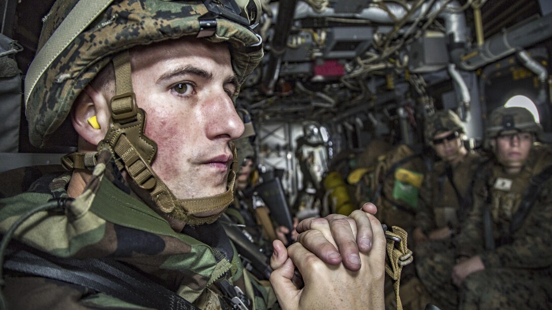 Marine Corps Staff Sgt. Dylan Worrell views the landscape from outside an MV-22 Osprey in Okinawa, Japan, March 21, 2017.  Worrell is an incident commander assigned to the 3rd Marine Division's Chemical, Biological, Radiological and Nuclear Platoon. The unit conducts response drills to enhance the commander’s capabilities. Marine Corps photo by Lance Cpl. Jesus McCloud