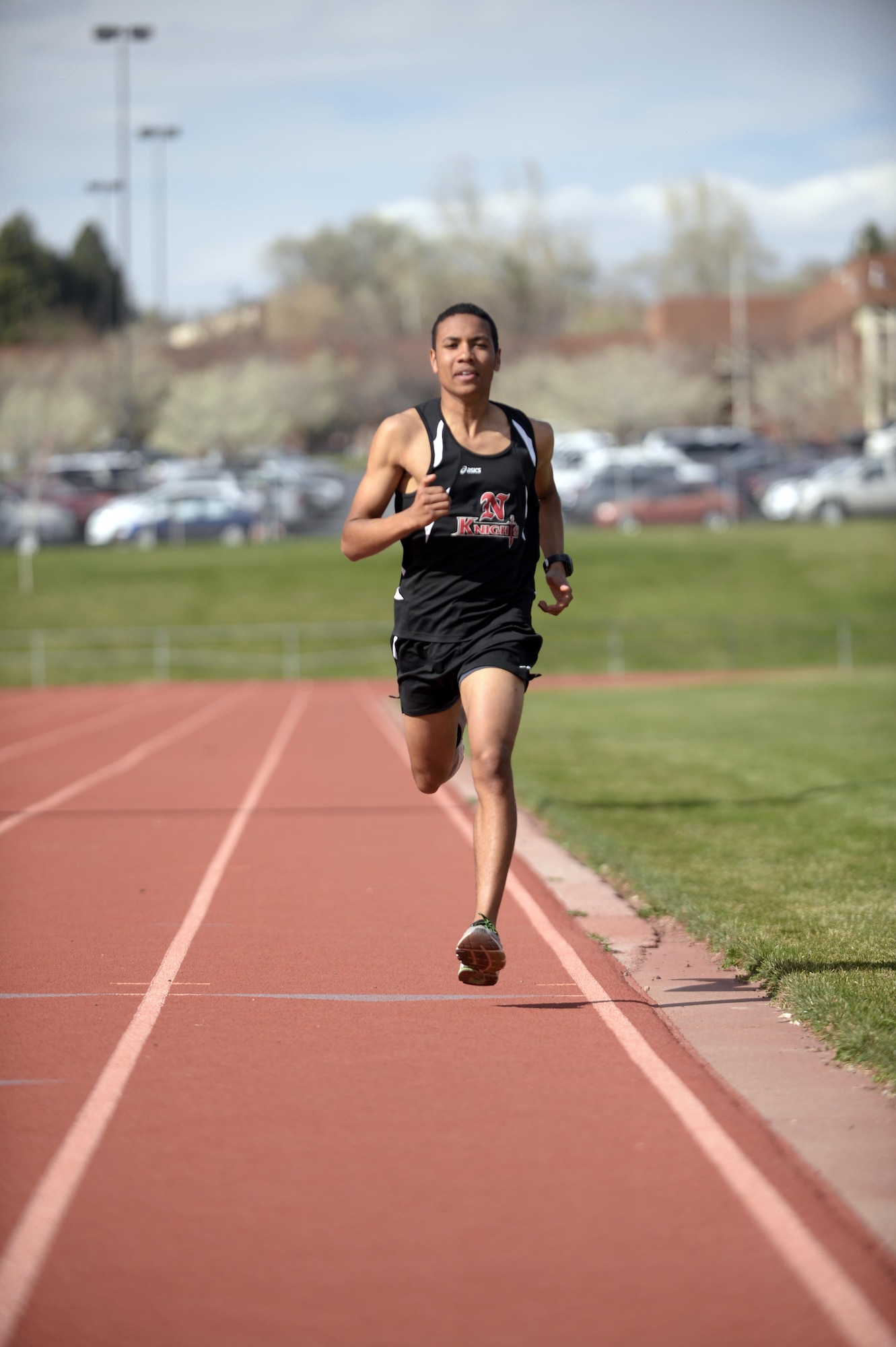 Jamal Braxton runs sprints on the track at Northridge High School in Layton, Utah, March 21. As a volunteer, Braxton likes to focus most on his experiences with the Red Cross and the Airmen and Family Readiness Center while living abroad in Germany and during his last three years at Hill Air Force Base, Utah. (Air Force photo/Todd Cromar)