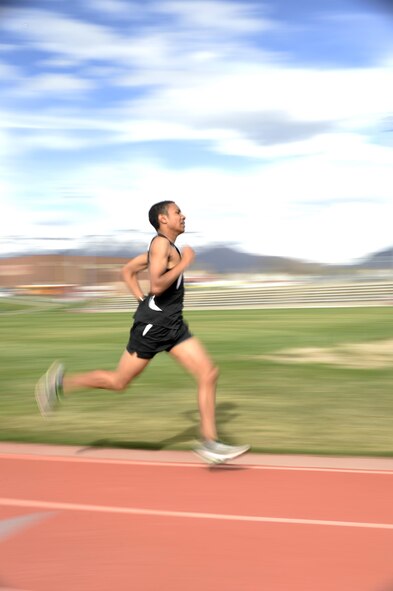 Jamal Braxton runs sprints on the track at Northridge High School in Layton, Utah, March 21. As a volunteer, Braxton likes to focus most on his experiences with the Red Cross and the Airmen and Family Readiness Center while living abroad in Germany and during his last three years at Hill Air Force Base, Utah. (Air Force photo/Todd Cromar)