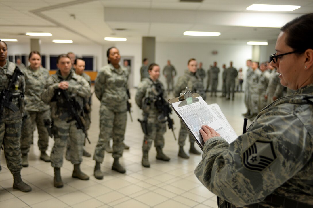 Master Sgt. Jessica Stoeger, a flight chief assigned to the 28th Security Forces Squadron, takes role call during evening guard mount inside the 28th Security Forces Squadron March 21, 2017 at Ellsworth Air Force Base, S.D. Stoeger helped coordinate an all-female Security Forces flight, filling every position from desk sergeant to patrol and gate security with a female defender. (U.S. Air Force photo by Airman 1st Class Randahl J. Jenson)