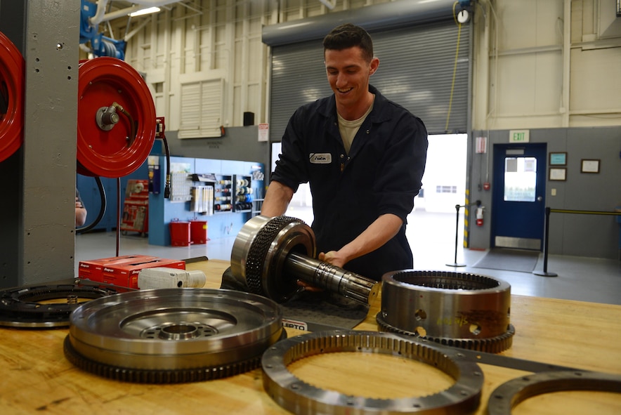 Airman 1st Class Justyn Zangwill, 627th Logistic Readiness Squadron fire truck and refuel maintenance journeyman, prepares to install a wet clutch assembly, March 21, 2017 at Joint Base Lewis-McChord, Wash. The wet clutch assembly was removed out of a fire truck and is being repaired, saving the Air Force an estimated $68,000. (U.S. Air Force photo/Senior Airman Divine Cox)