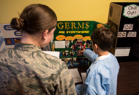 A student from Stephensen Elementary explains his science fair project to a judge at Mountain Home Air Force Base, Idaho, March 23, 2017. This year marks Stephensen Elementary's sixth annual science fair aimed at exposing children to science earlier. (U.S. Air Force photo by Senior Airman Connor J. Marth/Released)