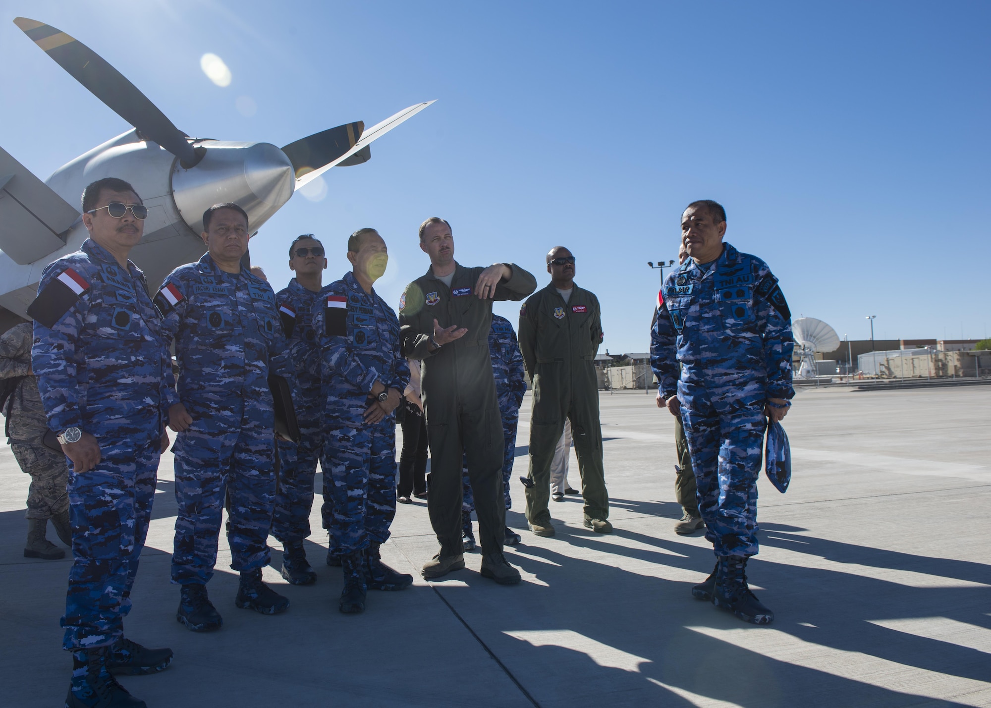 Lt. Col. Timothy Monroe, the 9th Attack Squadron commander, explains RPA operations to members of the Indonesian Air Force during a distinguished visitor tour at Holloman Air Force Base, N.M. on March 15, 2017. Members of the IDAF toured the MQ-9 Training Unit, and got an up, close and personal look at one of Holloman’s remotely piloted aircraft. (U.S. Air Force photo by Airman 1st Class Alexis P. Docherty)