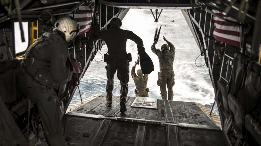 Marines jump from a CH-53E Super Stallion during an exercise in the Philippine Sea, March 19, 2017. The Marines, assigned to the Maritime Raid Force of the 31st Marine Expeditionary Unit, are embarked on the USS Bonhomme Richard. Navy photo by Seaman Apprentice Jesse Marquez Magallanes