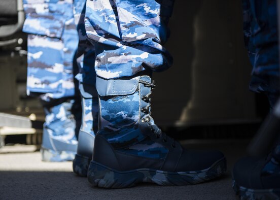 A member of the Indonesian Air Force stands inside a RPA Ground Control Station during a distinguished visitor tour at Holloman Air Force Base, N.M. on March 15, 2017. The IDAF delegation visited the base to learn about MQ-9 operations and Holloman’s RPA mission. (U.S. Air Force photo by Airman 1st Class Alexis P. Docherty)