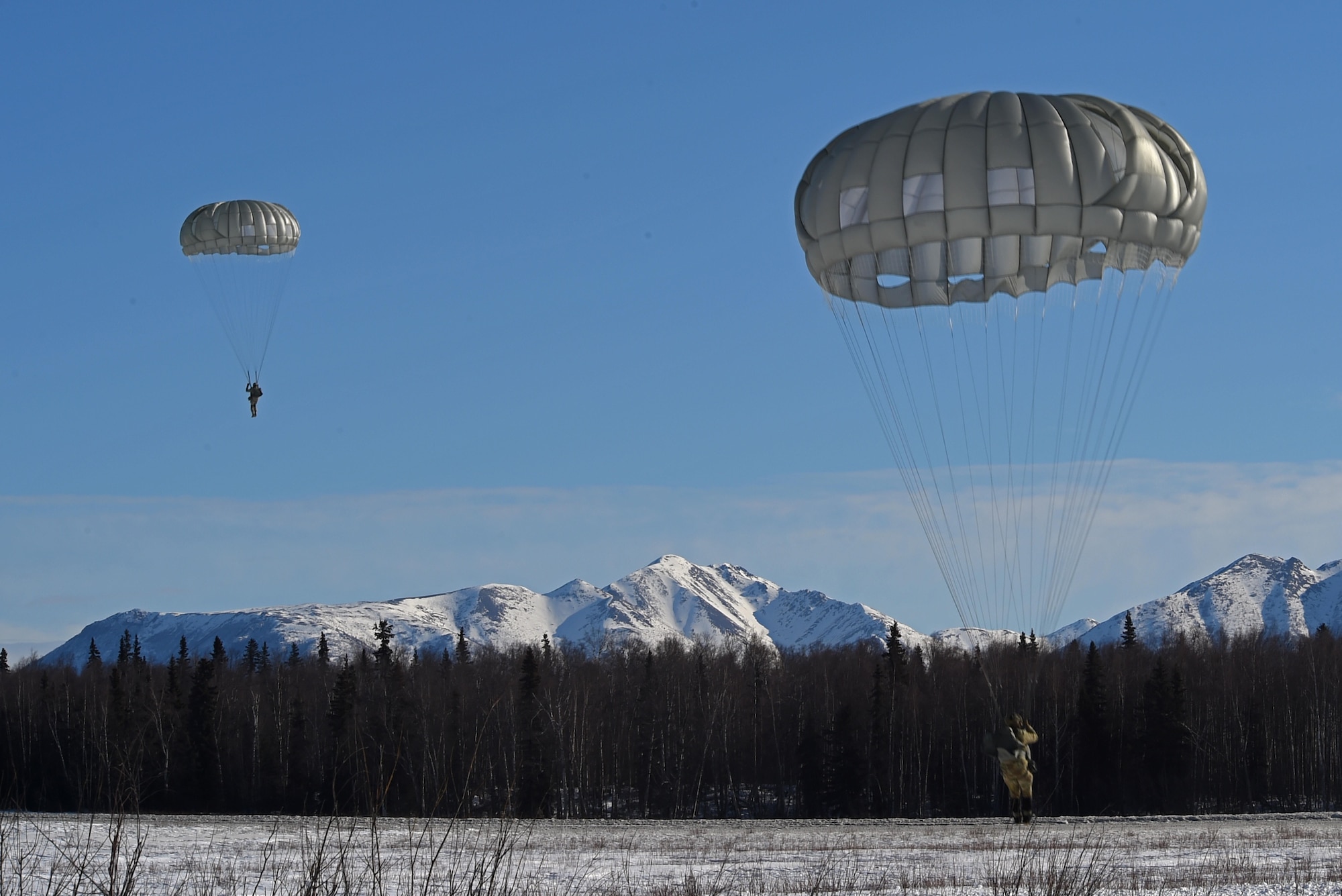 Tactical air control party Airmen with the 3rd Air Support Operations Squadron and paratroopers with the 4th Quartermaster Company, 725th Brigade Support Battalion (Airborne), 4th Infantry Brigade Combat Team (Airborne), 25th Infantry Division, U.S. Army Alaska,  conduct jump training out of UH-60 Black Hawks at the Malemute Drop Zone at Joint Base Elmendorf-Richardson, Alaska, March 22, 2017. Routine jump training is conducted to maintain proficiency and train for prospective missions. 