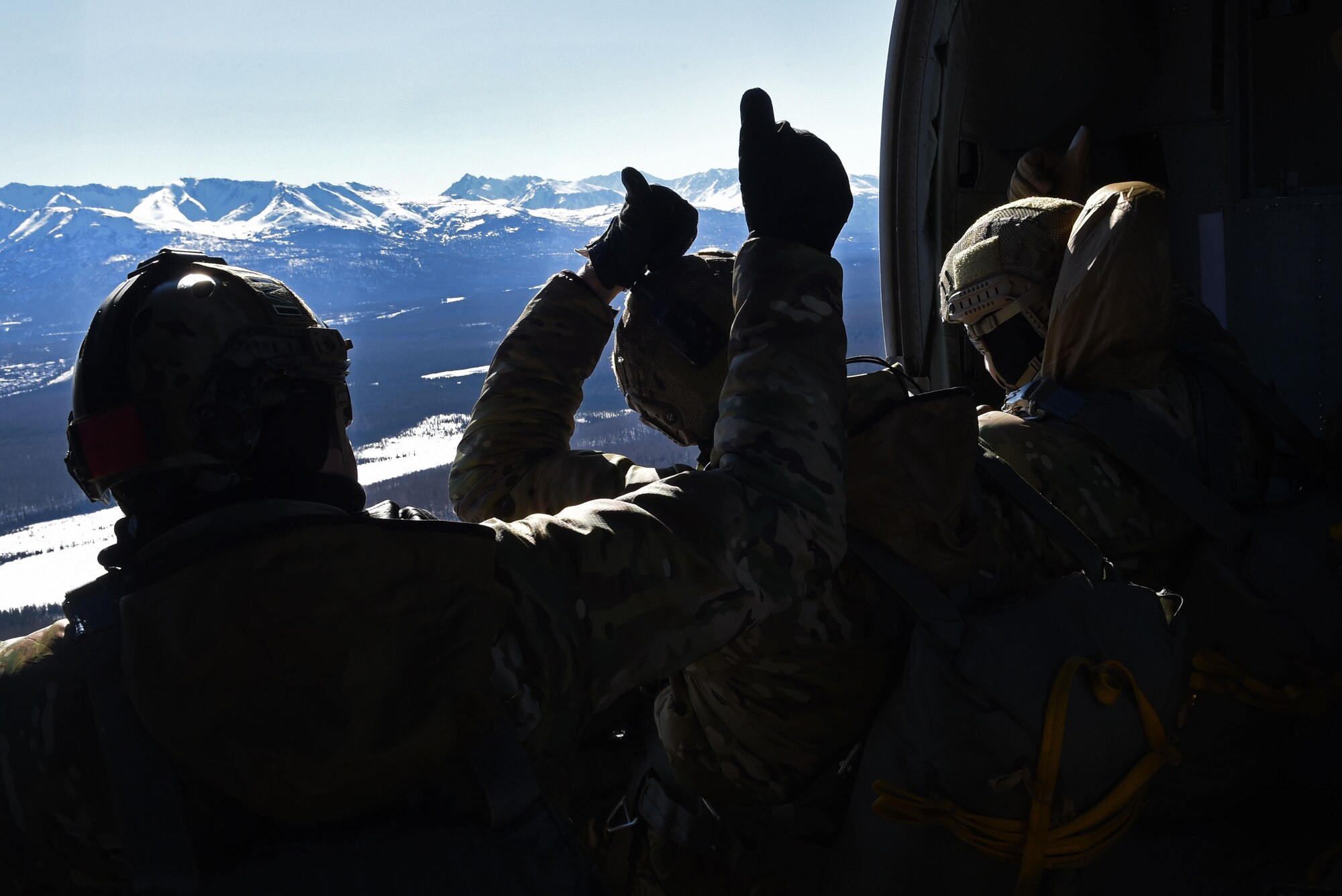 Tactical air control party Airmen with the 3rd Air Support Operations Squadron, prepare to jump out of a UH-60 Black Hawk during jump training at the Malemute Drop Zone at Joint Base Elmendorf-Richardson, Alaska, March 22, 2017. Routine jump training is conducted to maintain proficiency and train for prospective missions. 