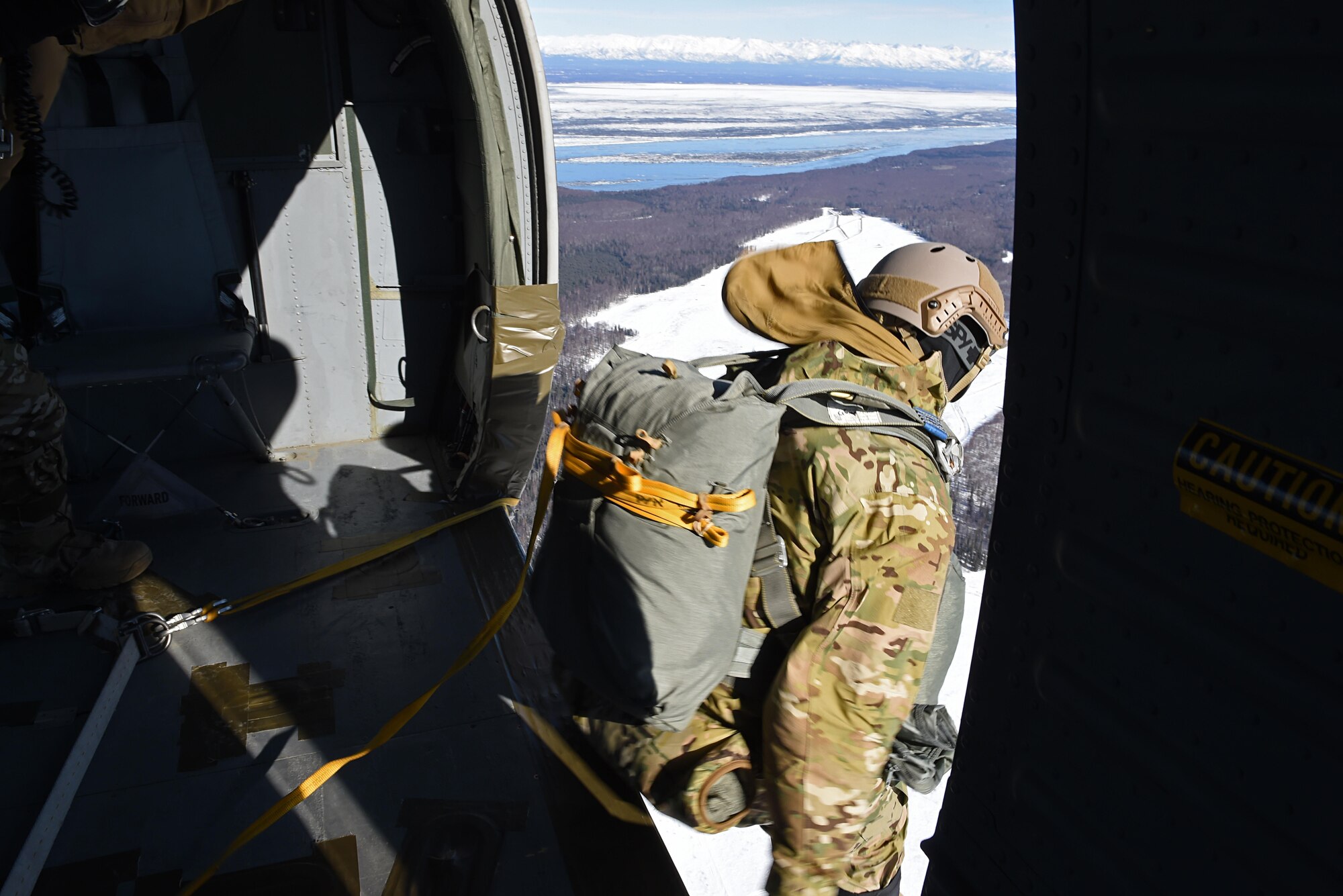 A tactical air control party Airman with the 3rd Air Support Operations Squadron, jumps out of a UH-60 Black Hawk during jump training at the Malemute Drop Zone at Joint Base Elmendorf-Richardson, Alaska, March 22, 2017. Routine jump training is conducted to maintain proficiency and train for prospective missions. 