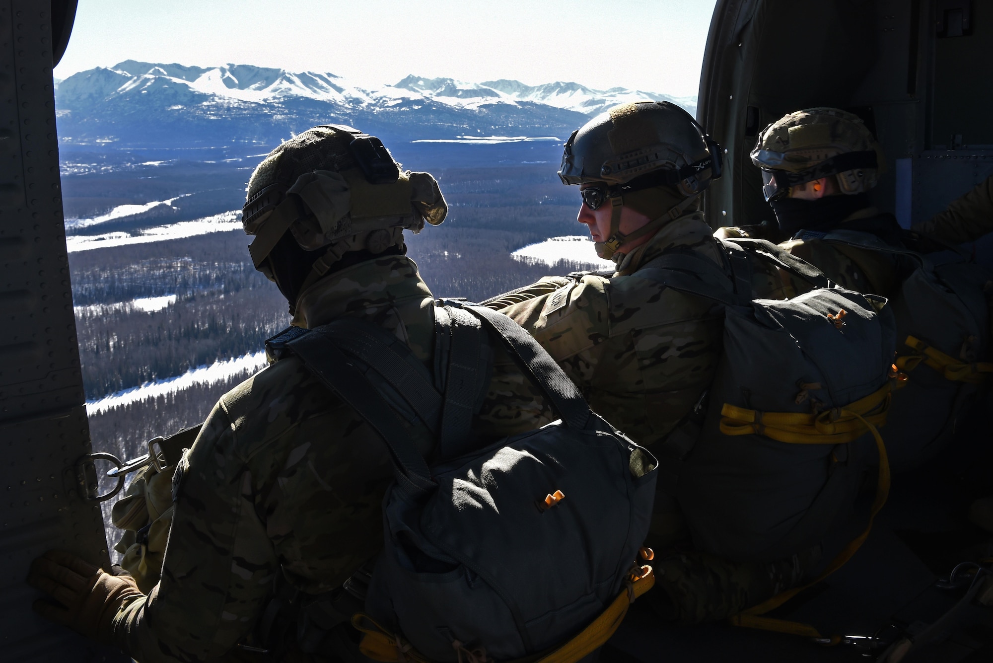 Tactical air control party Airmen with the 3rd Air Support Operations Squadron, prepare to jump out of a UH-60 Black Hawk during jump training at the Malemute Drop Zone at Joint Base Elmendorf-Richardson, Alaska, March 22, 2017. Routine jump training is conducted to maintain proficiency and train for prospective missions. 