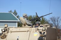 Army Reserve Spc. Benjamin Zachary, Combat Engineer, 366th Engineer Company, Canton New York, drives a M113 Armored Personnel Carrier off of the pre-qualification range with Staff Sgt. Brandon Coffey, Combat Engineer, 366th Engineer Company, manning a M2 .50 Caliber Machine Gun during the Operation Cold Steel exercise conducted at Fort McCoy, Wisconsin, Mar. 22, 2017. Operation Cold Steel is the U.S. Army Reserve’s first large-scale live-fire training and crew-served weapons qualification and validation exercise taking place from March 9 through April 25, 2017. Cold Steel is key to ensuring that America’s Army Reserve units and Soldiers are trained and ready to deploy on short-notice and bring combat-ready and lethal firepower in support of the Total Army and Joint Force partners around the world. In support of the Total Army Force, First Army Master Gunners participated in Cold Steel to provide expertise in crew level gunnery qualifications, and to develop Vehicle Crew Evaluator training, preparing units here and when they return to their home stations to conduct crew served weapons training and vehicle crew gunnery at the unit-level. 475 crews with an estimated 1,600 Army Reserve Soldiers will certify in M2, M19 and M240 Bravo crew served weapons mounted to various military vehicle platforms such as Humvees, Family of Medium Tactical Vehicles, Heavy Expanded Mobility Tactical Trucks, and Heavy Equipment Transport Systems across 12-day rotations (15 crews per cycle) through the seven-week exercise.
(U.S. Army Reserve photo by Master Sgt. Anthony L. Taylor)