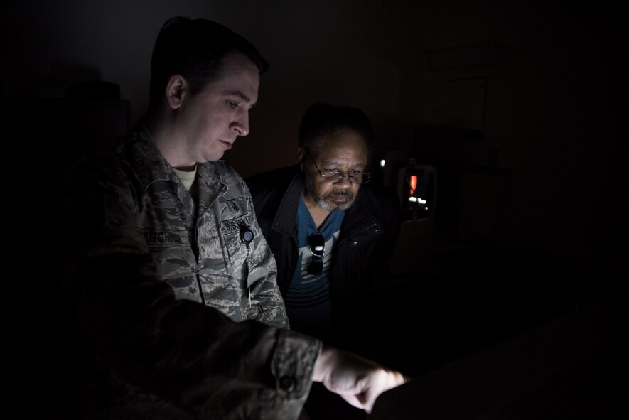 U.S. Air Force Tech. Sgt. Christopher Hutchinson, a 35th Aerospace Medicine Squadron optometry technician, reviews results of a visual field test with a patient at Misawa Air Base, Japan, March 8, 2017. Visual field tests detect central and peripheral vision problems caused by glaucoma, stroke and other eye or brain complications. The mission of the 35th Fighter Wing is to provide worldwide deployable forces, protect U.S. interests in the Pacific and defend Japan with sustained forward presence; without optimal eye health Airmen can’t focus on the mission. (U.S. Air Force photo by Staff Sgt. Melanie A. Hutto)