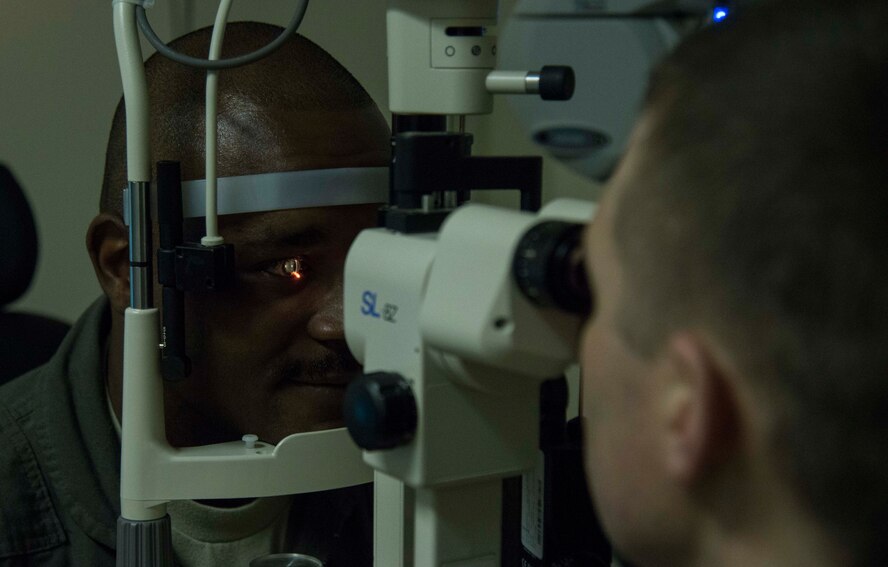 U.S. Air Force Maj. Ethan Woodbury, the 35th Aerospace Medicine Squadron optometry flight commander, uses a slit lamp to examine a patient’s eyes at Misawa Air Base, Japan, March 9, 2017. Slit lamps determine a patient’s ocular health by examining areas including the eyelids, cornea and iris. The 35th FW’s foundation is people and ensuring Airmen are prepared to execute the mission of Pacific stability and security at all times and the Misawa Optometry clinic does just that. (U.S. Air Force photo by Staff Sgt. Melanie A. Hutto)