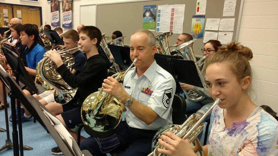 March 1st we were at Sidney Lanier Middle School in Fairfax, VA. as part of our Advancing Innovation Through Music (AIM) initiative. Pictured is one of our stellar horn players, SMSgt Krzywicki, influencing young students through his own fine playing. (Photo/Charlie Burts/released)